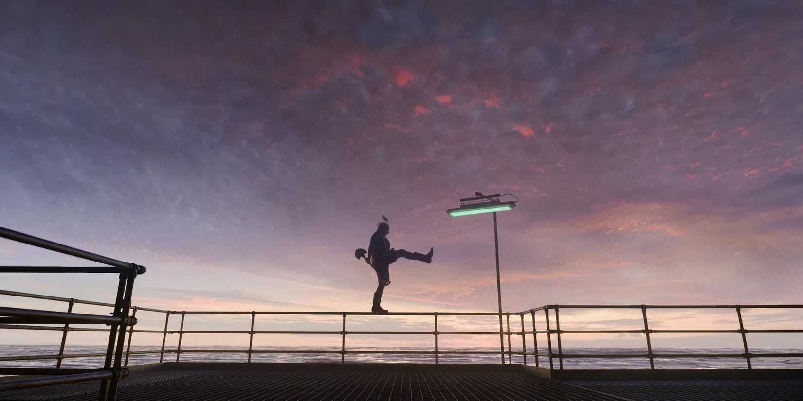A man balancing on a railing on one leg while holding a shovel in 'Digger'