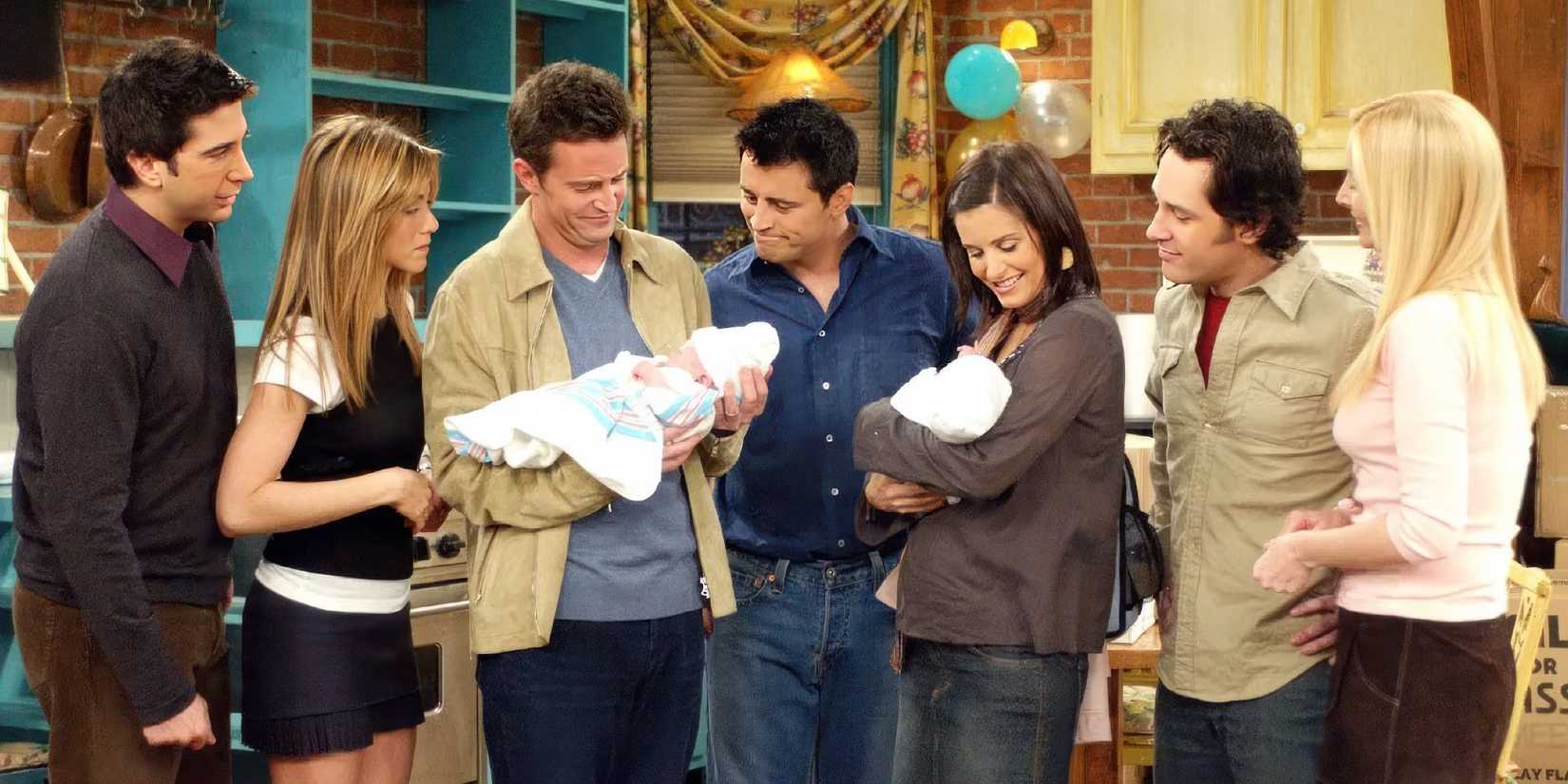 The cast of Friends sharing a tender moment in the series finale as they welcome the babies