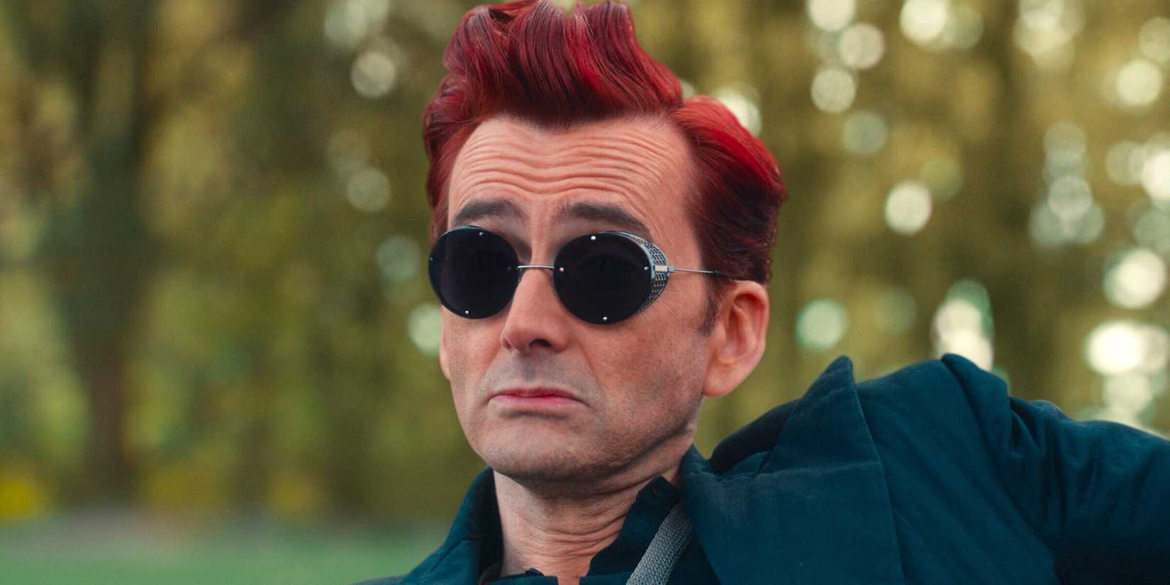 David Tennant raising his eyebrows whilst wearing sunglasses in 'Good Omens' 