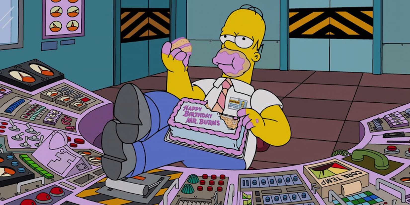 Homer (Dan Castellaneta) has his feet up on the safety console while eating birthday cake in The Simpsons.