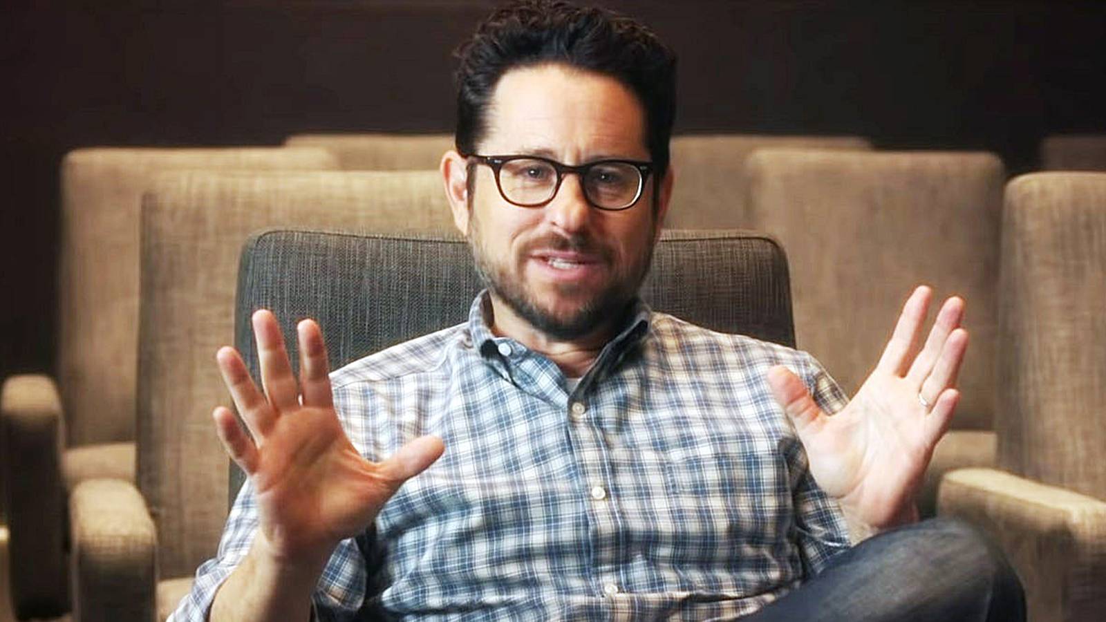 J.J. Abrams sitting and talking in a chair 