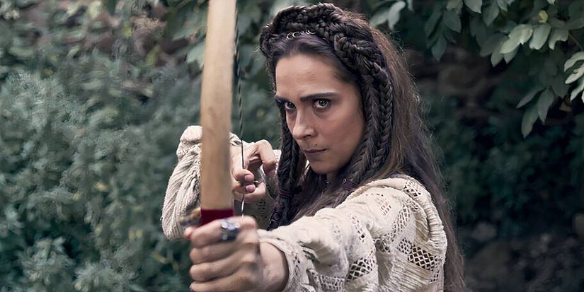 Netflix series, Luna Nera's character holding a bow ready to fire.