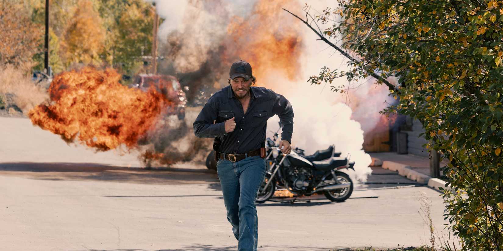 Kayce Dutton (Luke Grimes) runs from an exploding row of motorbikes in the 'Marshals' episode "Out of the Shadows"