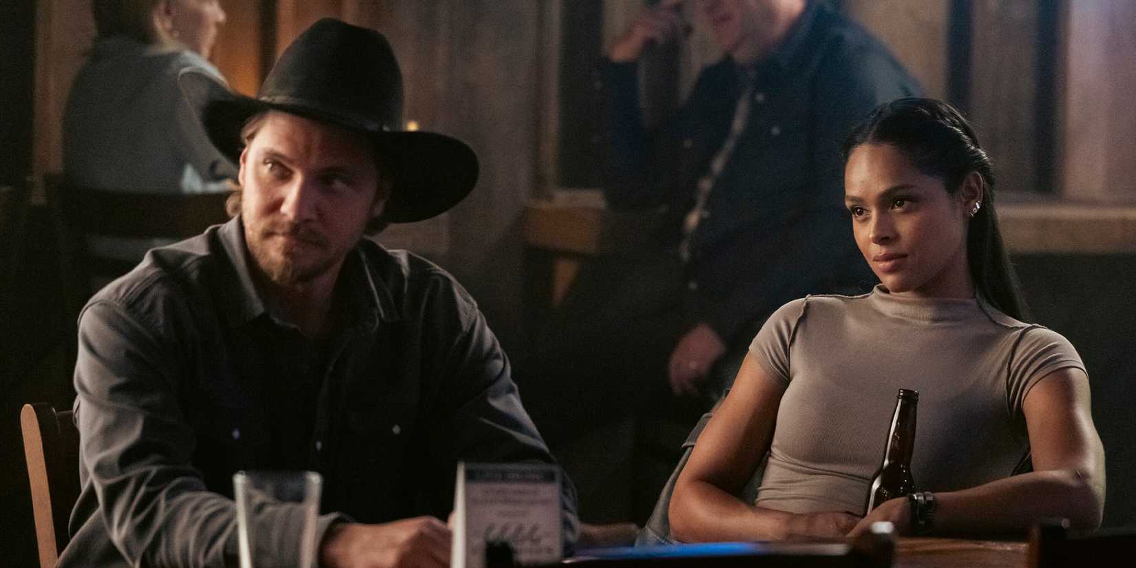 Kayce Dutton (Luke Grimes) and Andrea Cruz (Ash Santos) watch the bar in the 'Marshals' episode "Family Business"