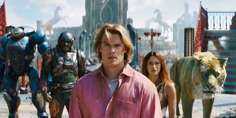 Idris Elba as Man at Arms, Nicholas Galitzine as Prince Adam, and Camila Mendes as Teela in Masters of the Universe.
