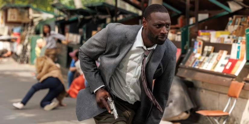 Omar Sy running with a gun in The Killer - 2024 - John Woo - Peacock