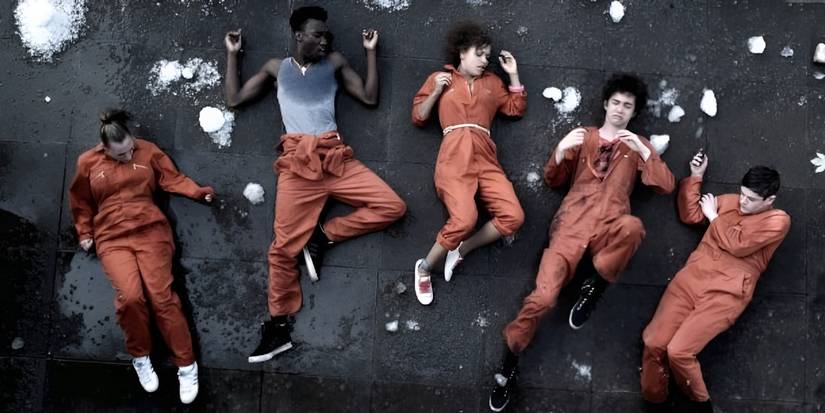 The cast of Misfits after they've been knocked onto the ground