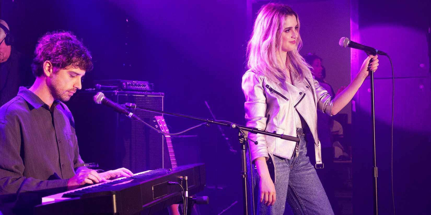 Danny plays keyboard and Ryan Reed sings on stage.