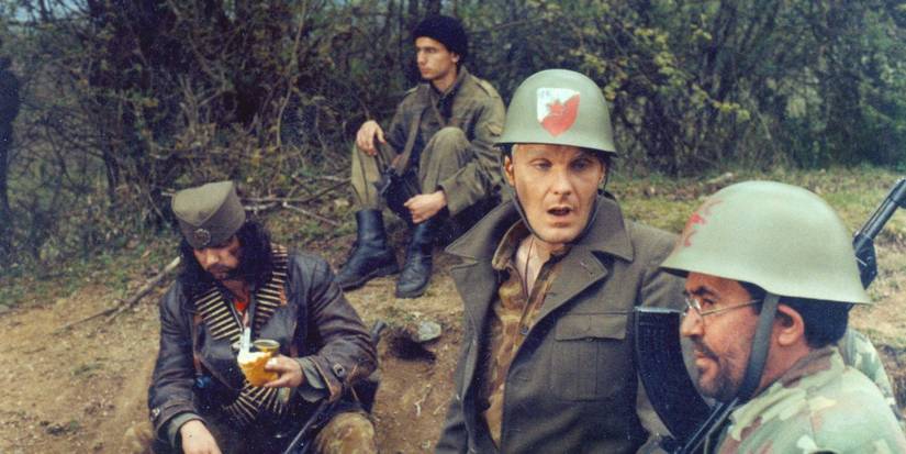 A group of soldiers sitting around in 'Pretty Village, Pretty Flame'