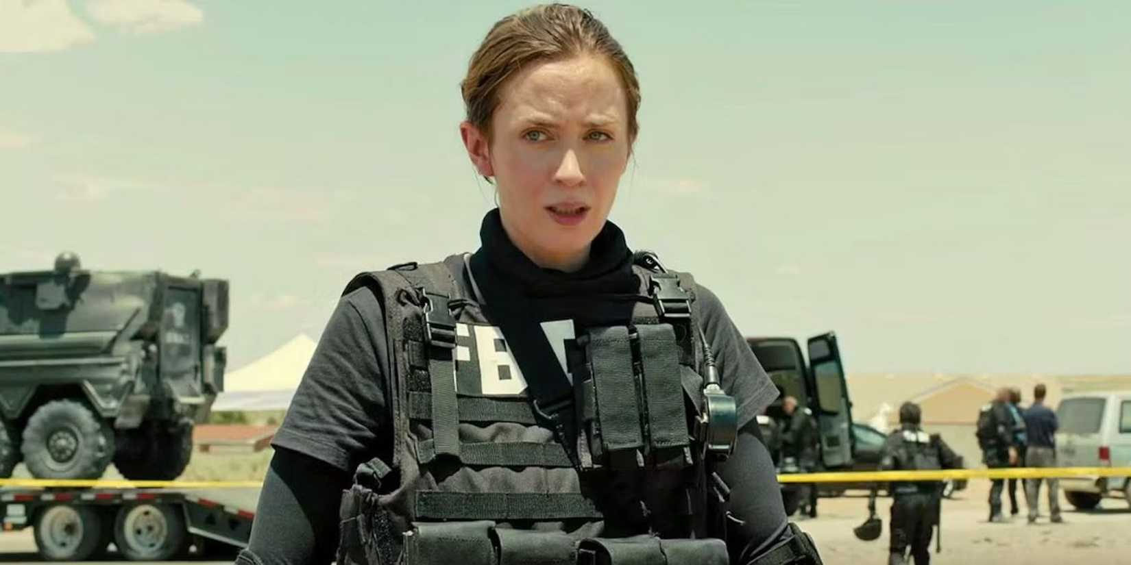Emily Blunt as Kate stands in tactical gear while looking concerned in Sicario.