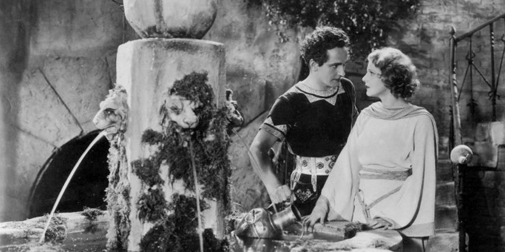 Marcus Superbus (Fredric March) stands with Mercia (Elissa Landi) beside a fountain in 'Sign of the Cross' (1932)