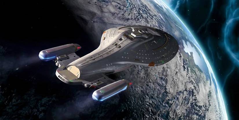 The USS Voyager spaceship sailing above a planet in Star Trek: Voyager