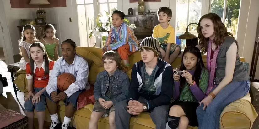 The ensemble cast of kids sitting on a couch in Yours Mine and Ours 2005