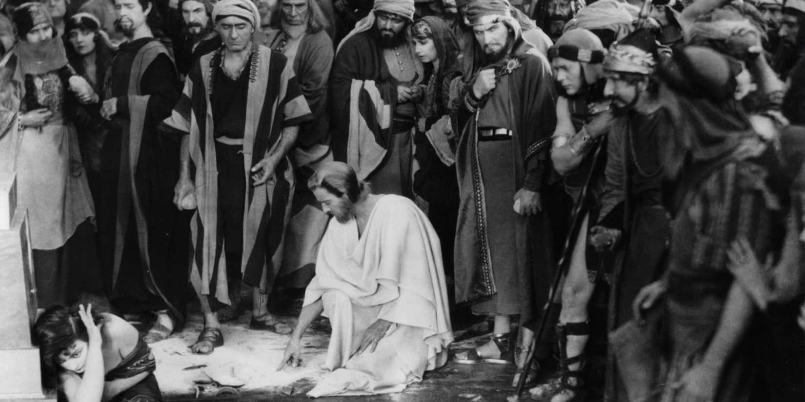 Jesus Christ (H.B. Warner) encounters the adulterous woman (Viola Louie) surrounded by a crowd in Cecil B. DeMille's 'The King of Kings' (1927)