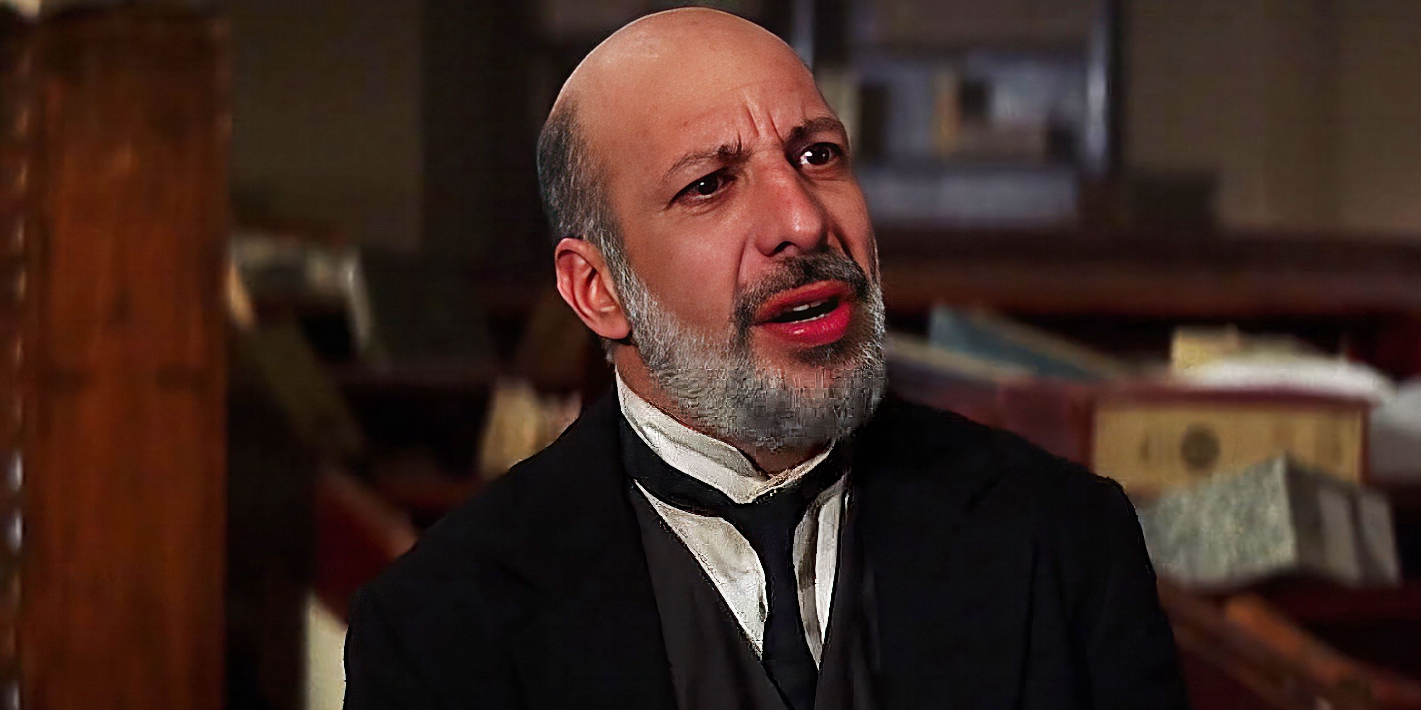 Erick Avari wears a suit and looks off camera in The Mummy