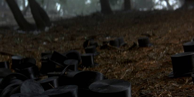 Top hats lying on the ground in 'The Prestige'
