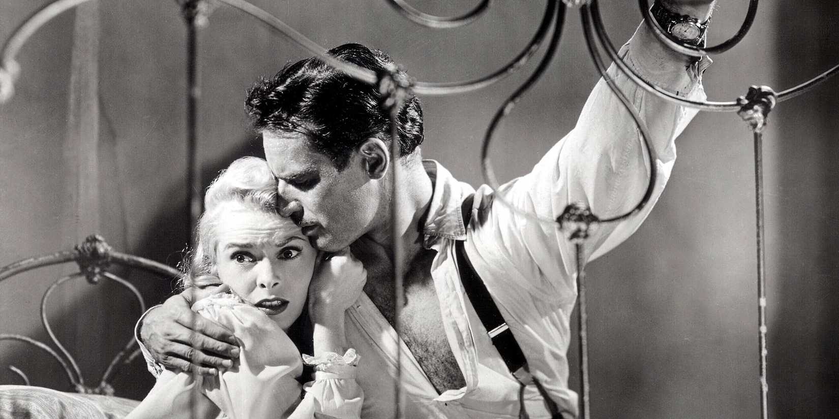 Charlton Heston embracing Janet Leigh in Touch of Evil