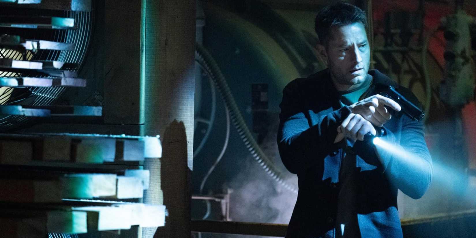 Colter Shaw (Justin Hartley) with his gun and flashlight in the 'Tracker' episode "Struck"
