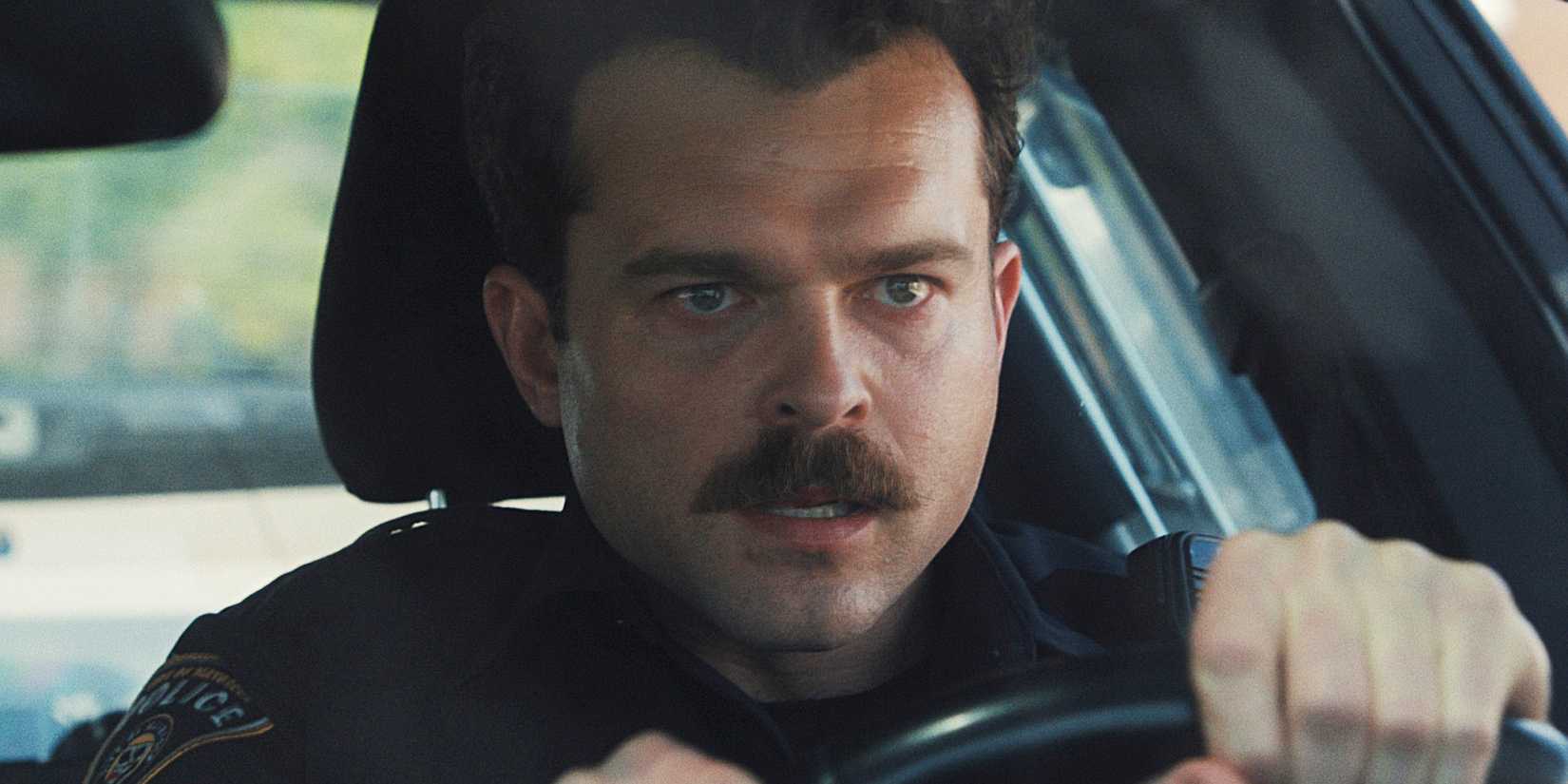 Alden Ehrenreich driving a car in a panic in 'Weapons'