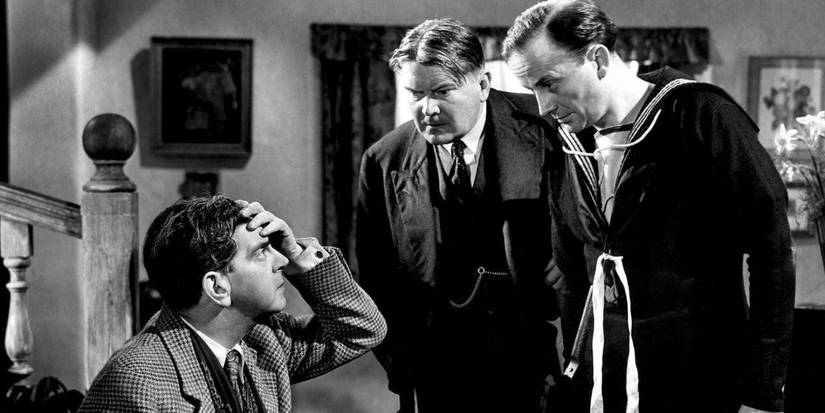 Villager menaced by Nazi soldiers in Went The Day Well