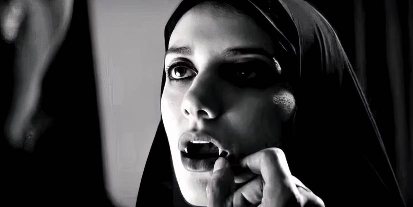 A young woman opens her mouth to reveal fangs in A Girl Walks Home Alone At Night.