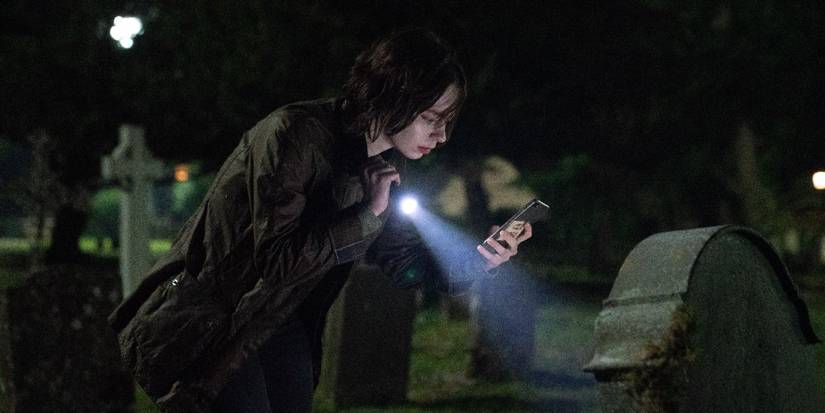 Emma Myers as Pip at a graveyard in A Good Girl's Guide to Murder Season 2.