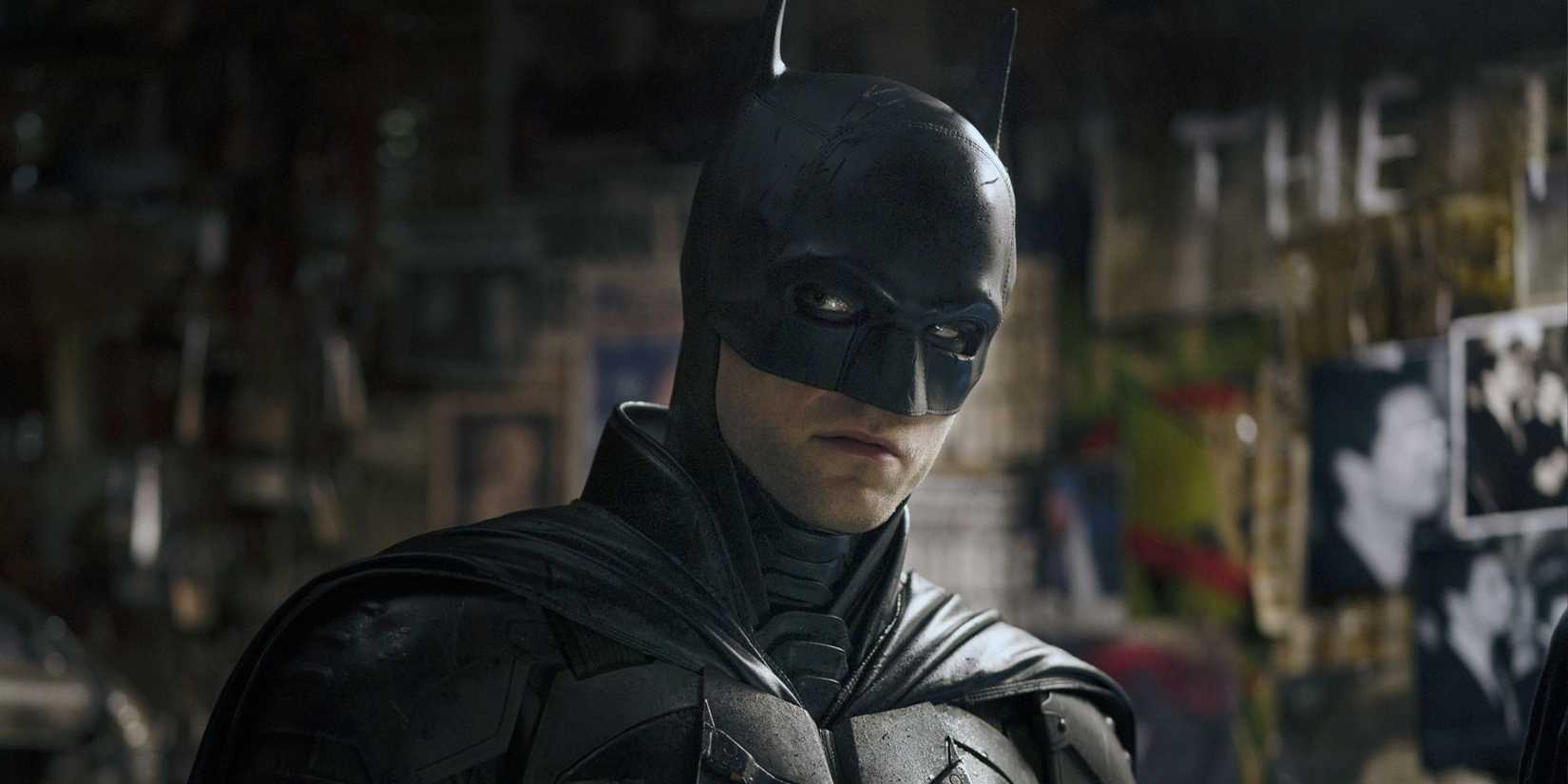 Robert Pattinson as Batman looking to the side in The Batman.