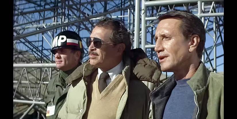 Three men looking at something in Blue Thunder