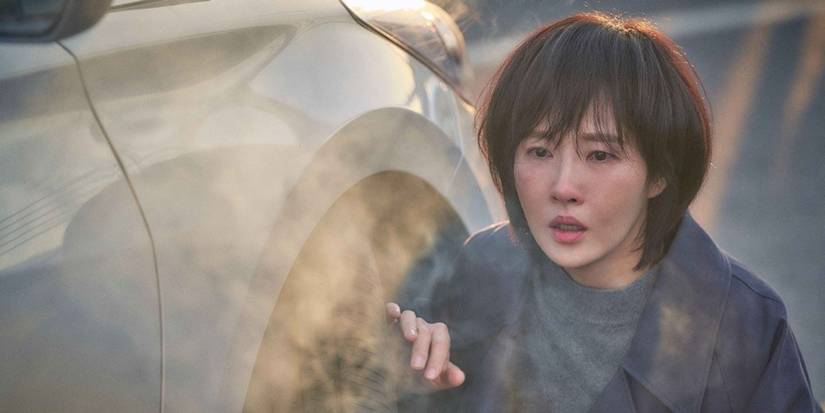 Kim Sun-a next to a car looking dishevelled in Children of Nobody