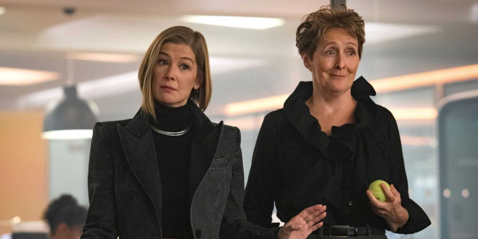  Rosamund Pike & Fiona Shaw stand in an office