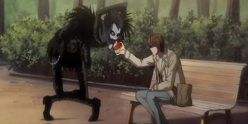 Light offering an apple to Ryuk in Death Note