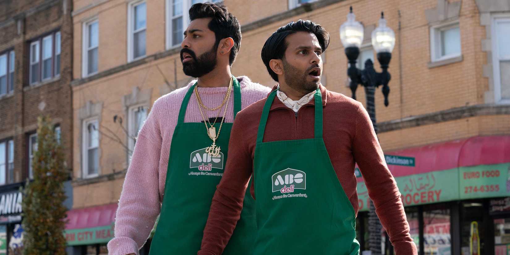 Asif Ali and Saagar Shaikh with aprons on, outside, in Deli Boys.