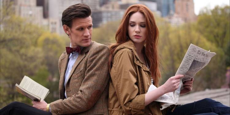 Matt Smith and Karen Gillan sitting back-to-back in 'Doctor Who'