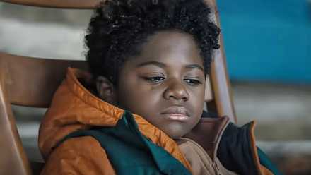 a tear trickles down a young child's cheek in 'Elevation'