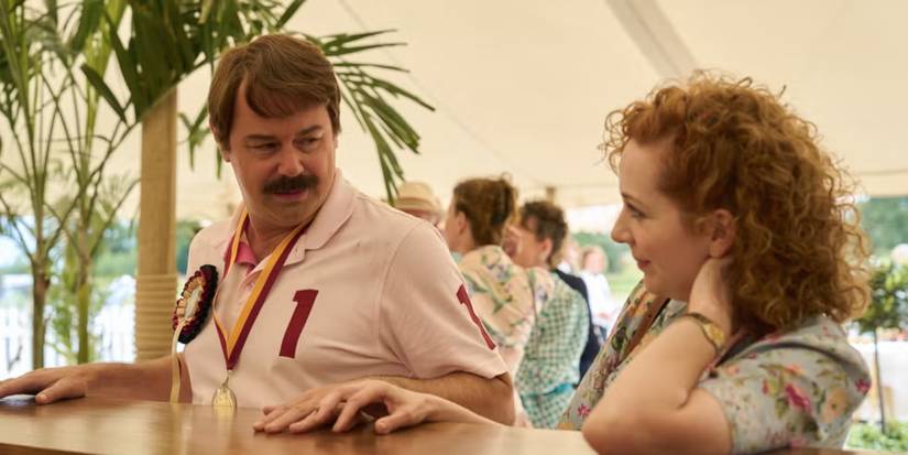 Danny Dyer and Katherine Parkinson looking at each other gently and talking in Rivals Season 2