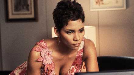 Halle Berry lying on the bed in Die Another Day