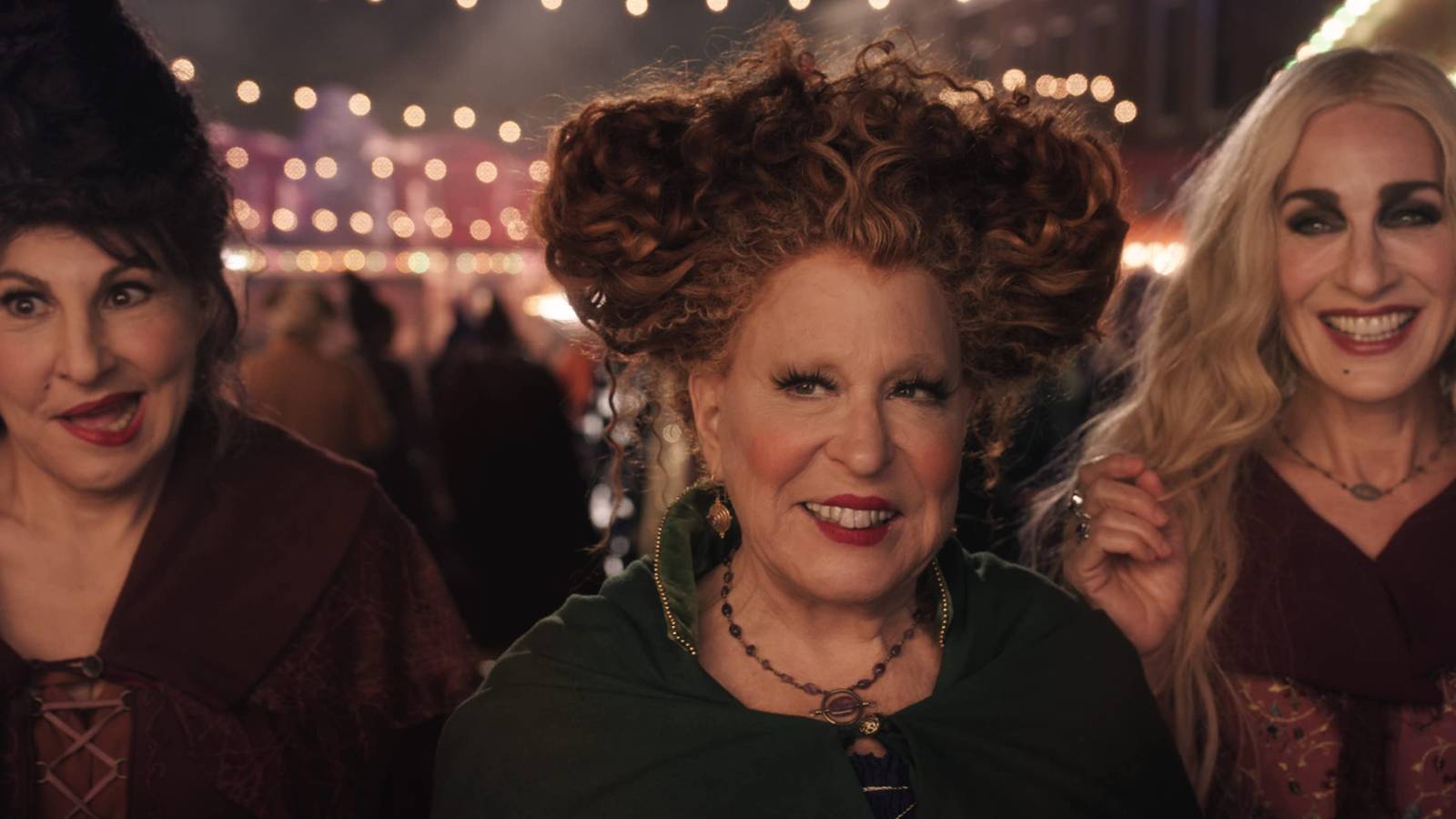Kathy Najimy, Bette Midler, and Sarah Jessica Parker wickedly smiling in Hocus Pocus 2