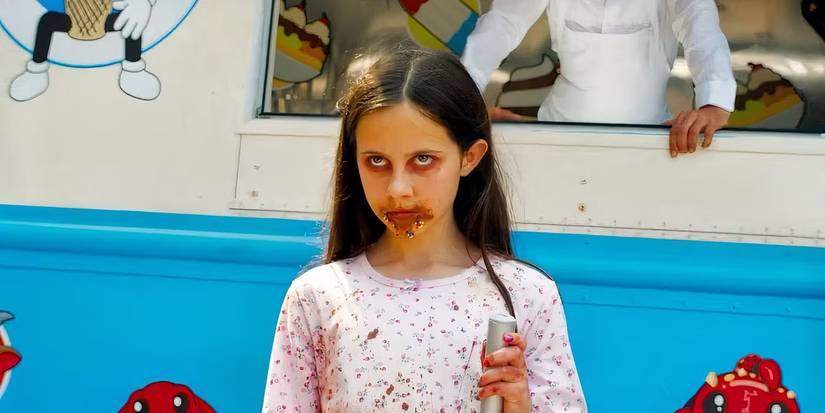 A girl with icecream over her face in Ice Cream Man