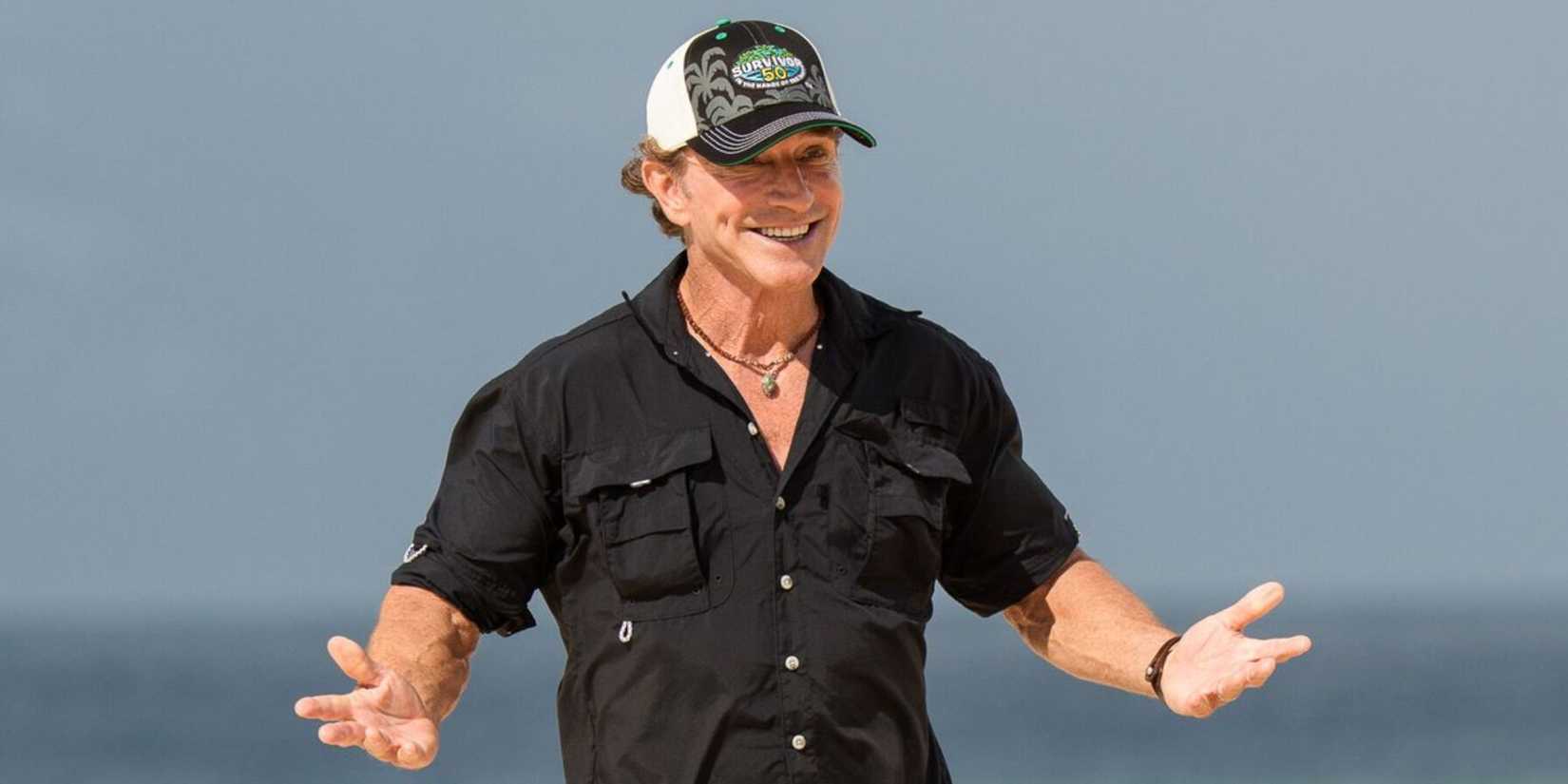 Jeff Probst in Survivor 50 with his hands out smiling.