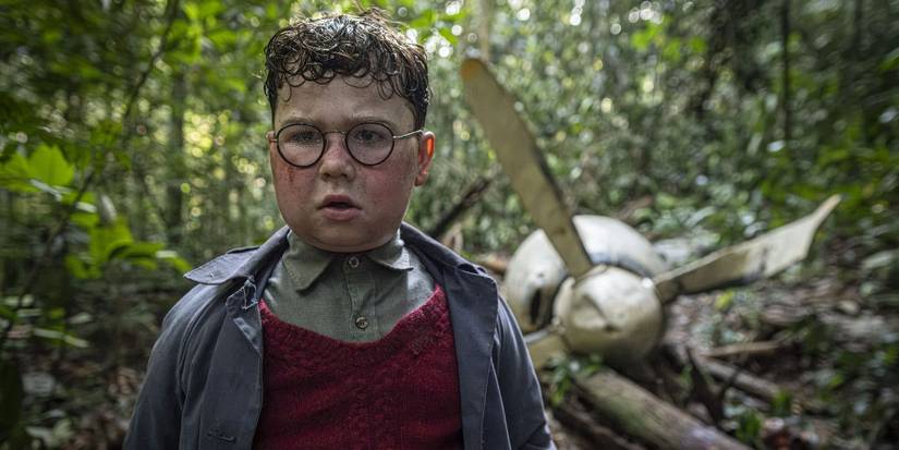 Piggy (David McKenna) stands in front of a plane propeller in 'Lord of the Flies'