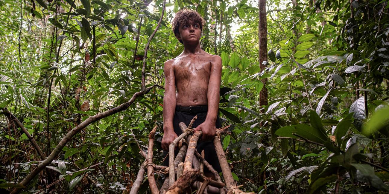 Ike Talbut as Simon pulling wood through the jungle in Lord of the Flies