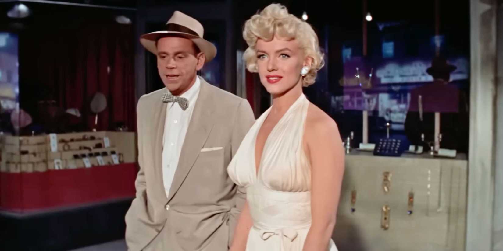 Marilyn Monroe standing next to Tom Ewell in The Seven Year Itch (1955)