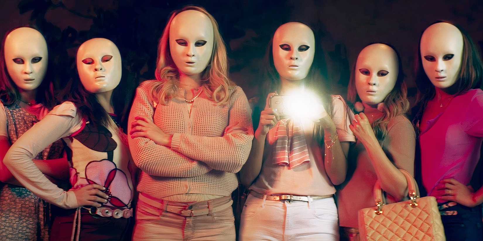 Scary masked women take a photo in Medusa, Brazil horror movie