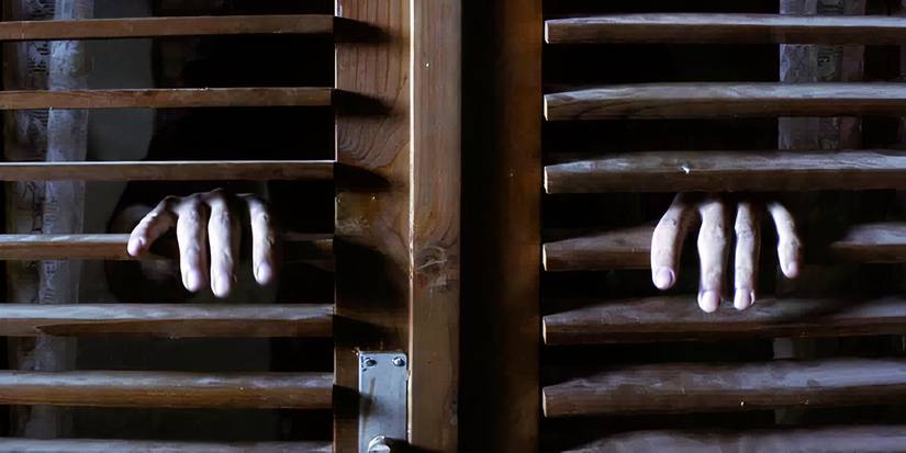 'Vampir' (2021) — Serbia - some ghastly hands come through some old wooden shutters of a window