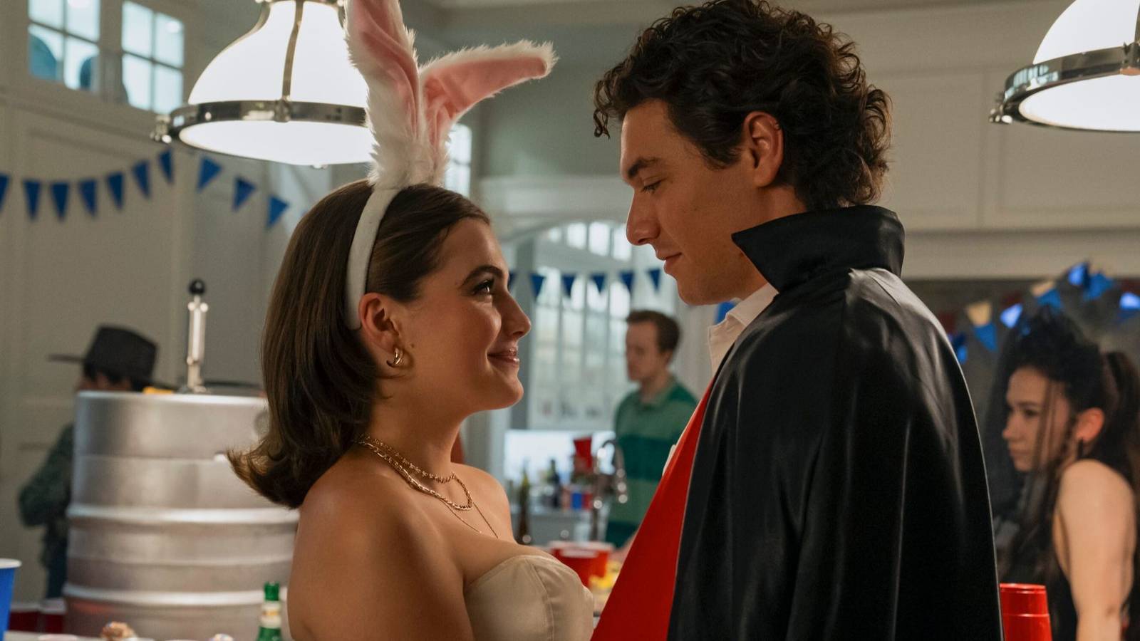Hannah and Garrett at a themed birthday party in 'Off Campus' Season 1, Episode 2