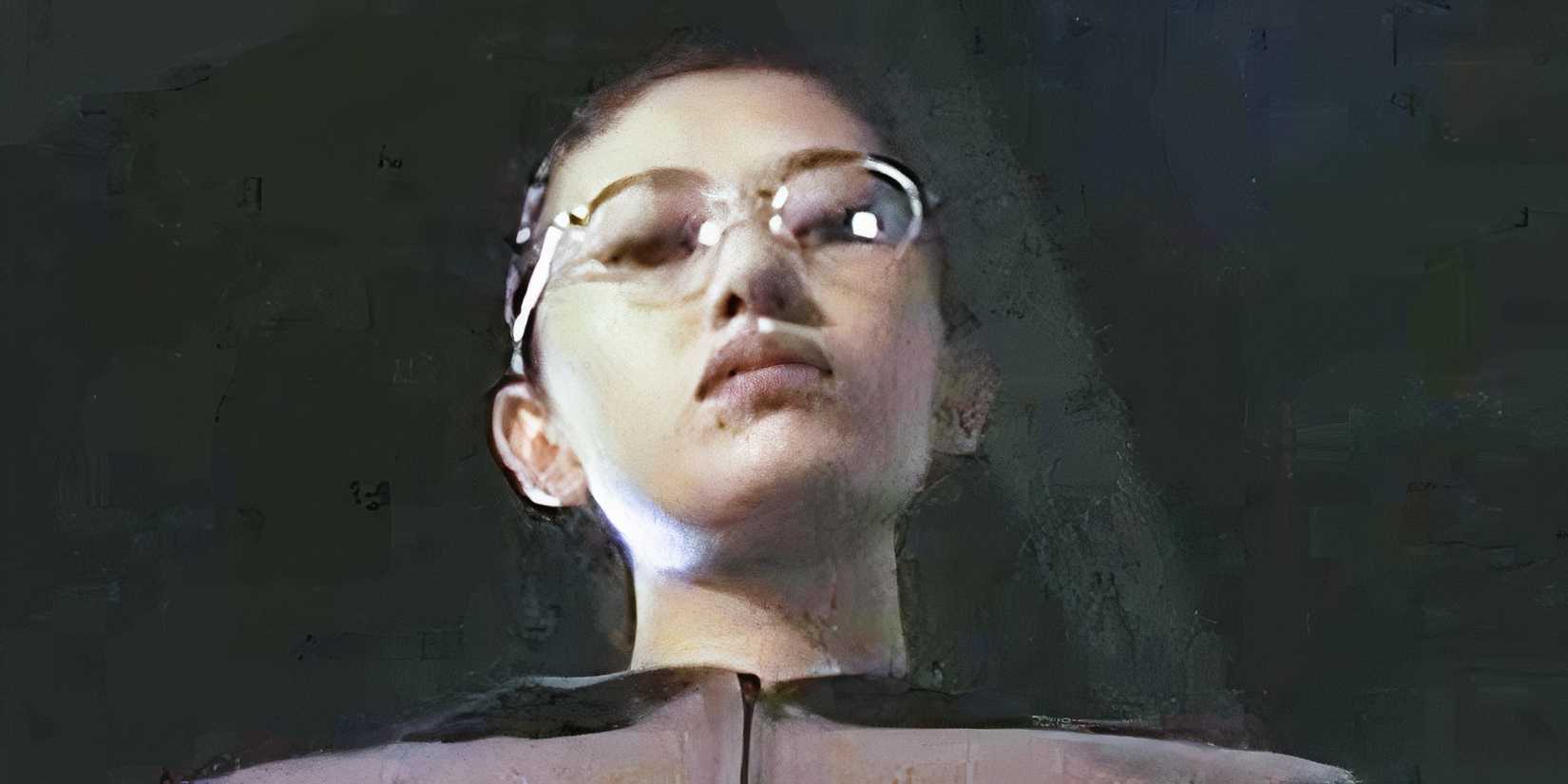 Woman with glasses stares down in Organ, Korea body horror