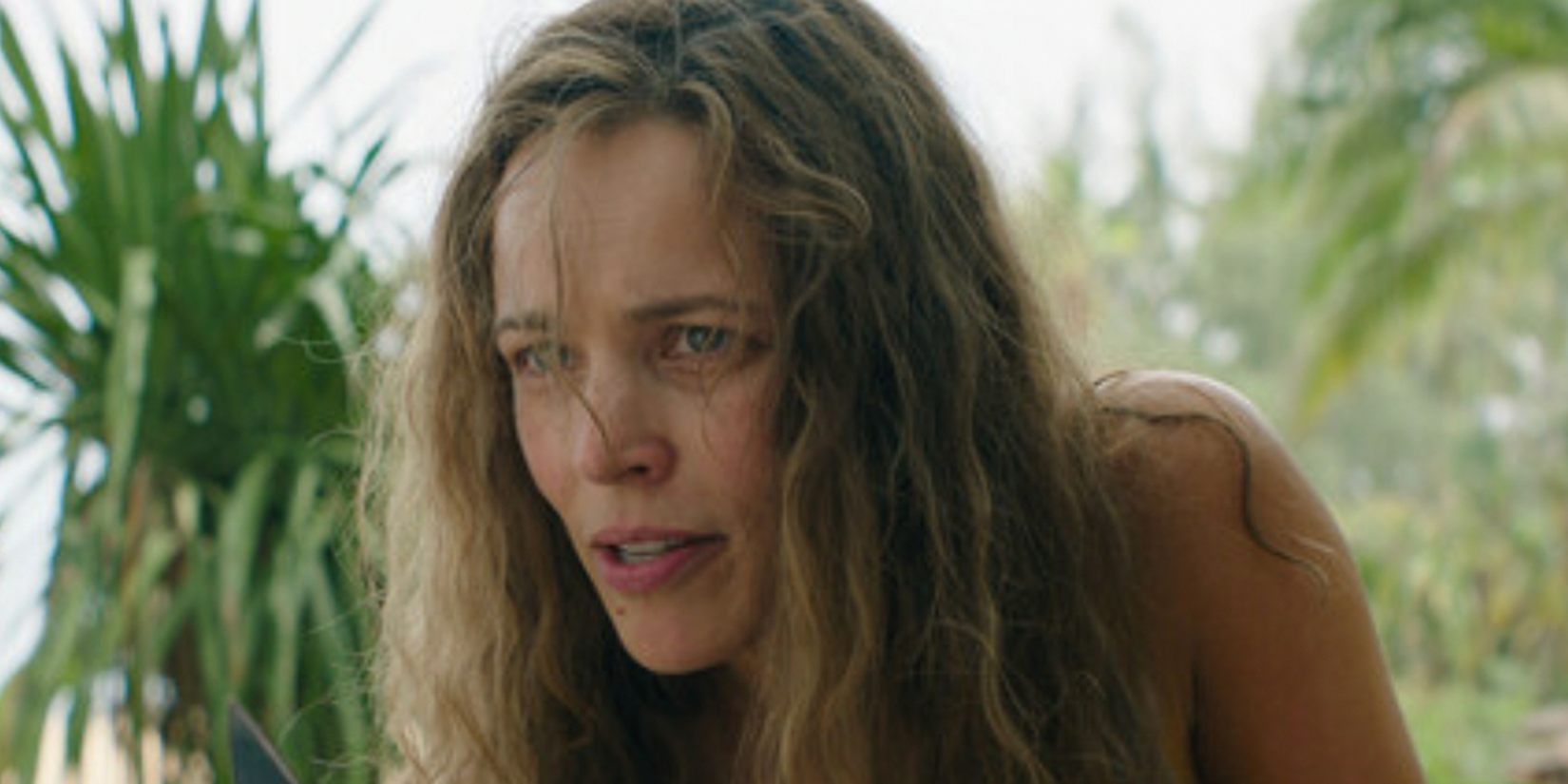 Rachel McAdams as Linda leaning forward talking in 'Send Help'