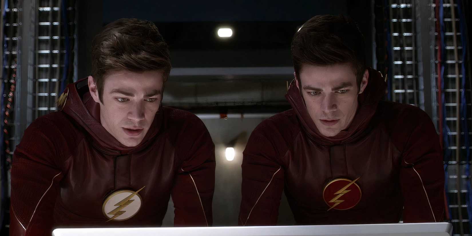 Seasons 1 and 2 Barry Allen standing at a computer together in The Flash Season 2, Episode 17