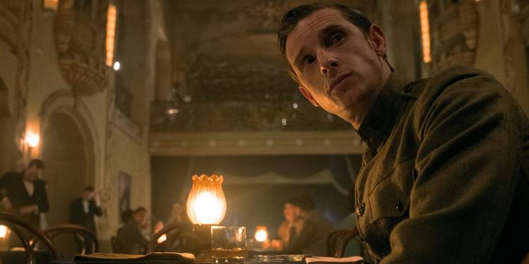 Jamie Bell in a WWI uniform in a club in 'Shining Girls'