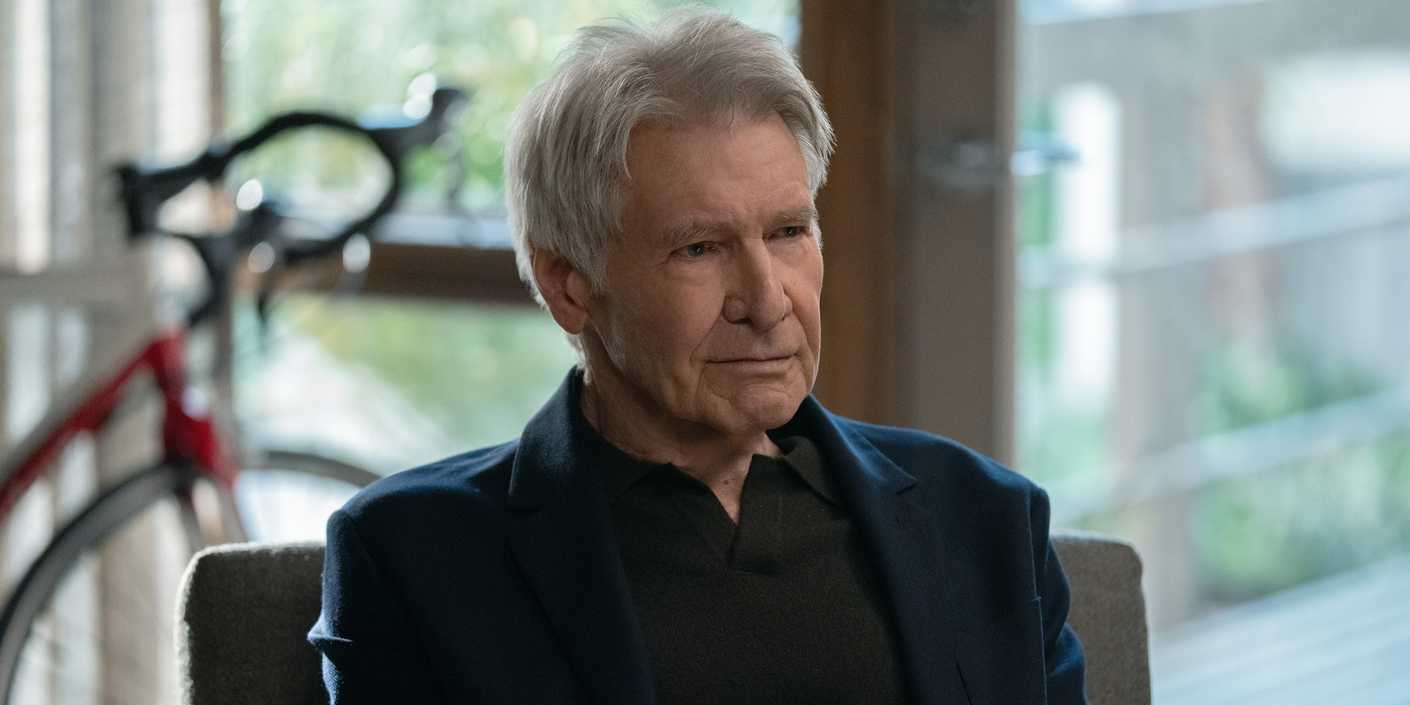 Harrison Ford sitting with a bike behind him in Shrinking Season 3